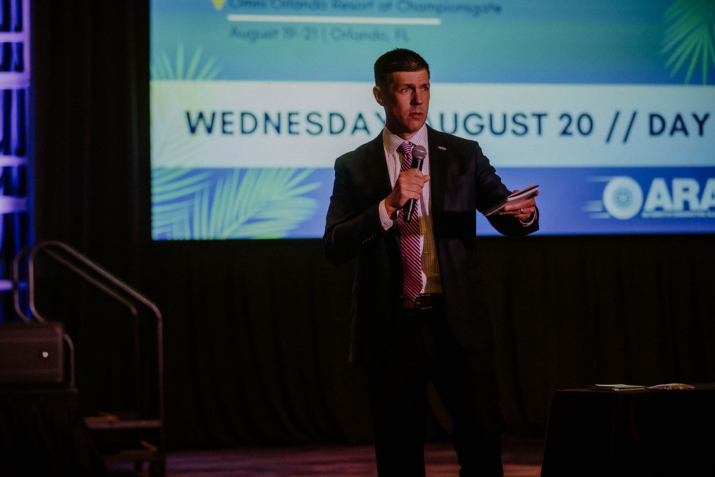 Woman on Connect stage giving presentation