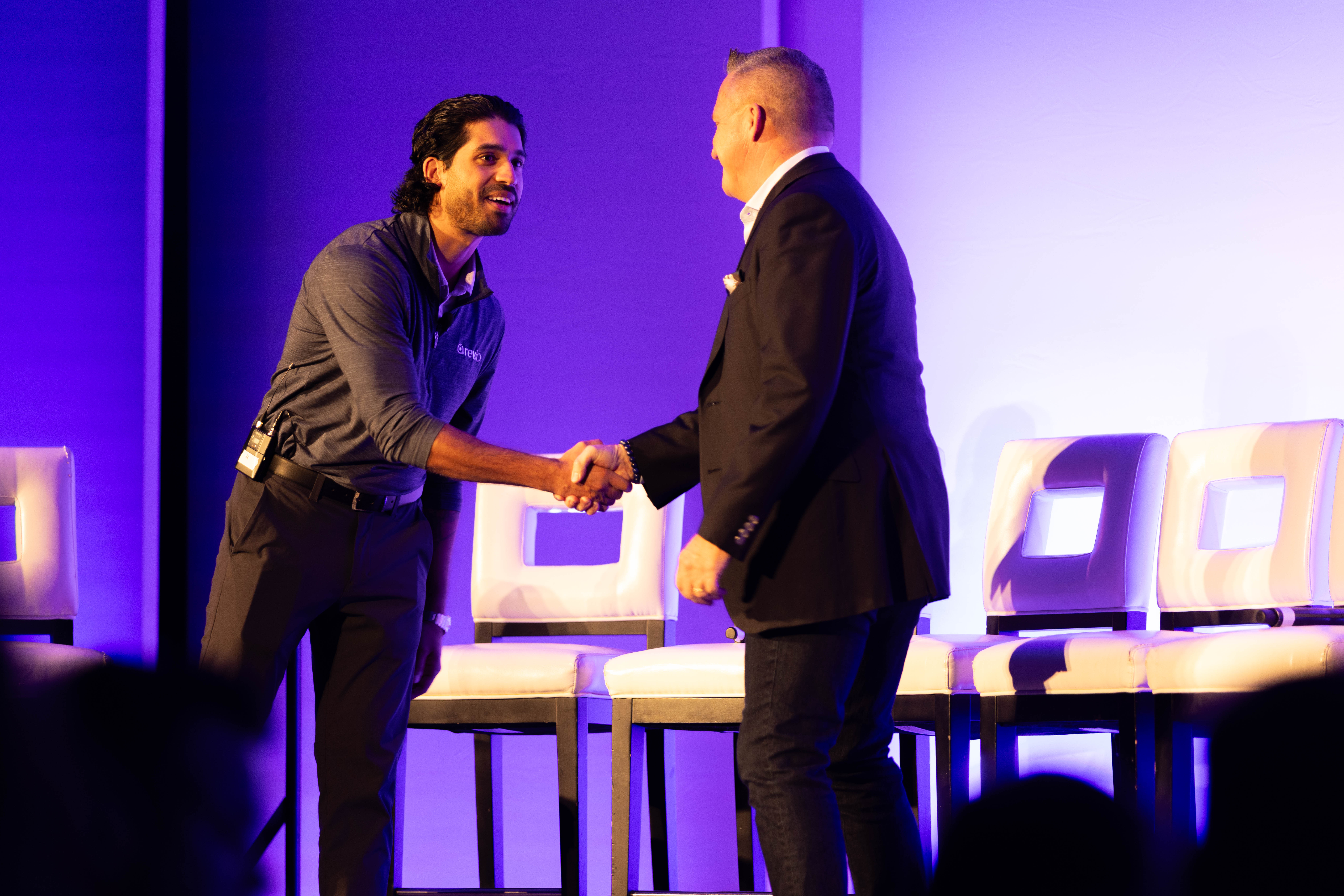 Speakers on stage at Rev.io Summit
