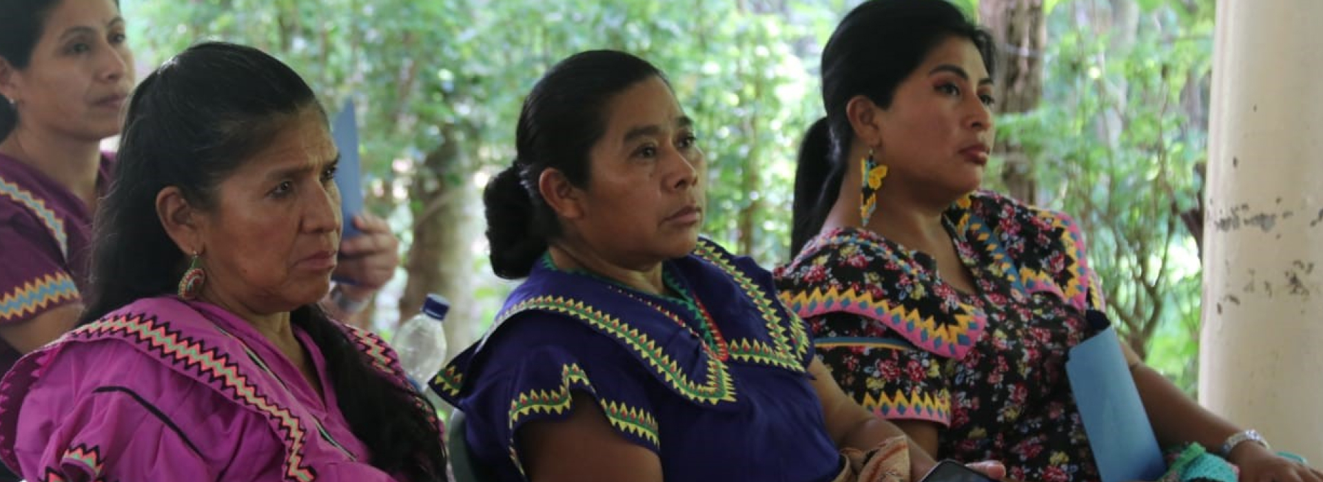 Photo of 3 female indigenous leaders in colourful traditional clothing, who are part of the autonomous traditional authorities in the Ngäbe Bugle community, participating in local DRR activities, in Panama.